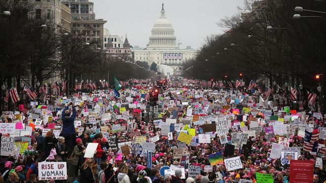 Protesters walk up Pennsylvania Avenue during the Women's March on Washington, with the U.S. Capitol in the background, on January 21, 2017