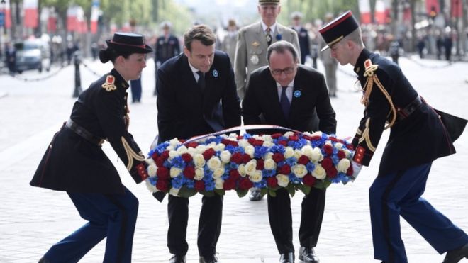 Mr Macron (centre left) on his first duty as president-elect, with President François Hollande (centre right), laying a wreath in Paris