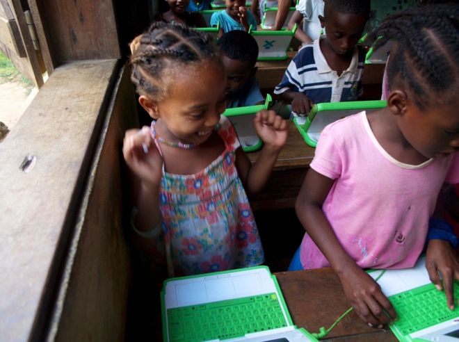 Madagascar, 2012. Children use their laptops.