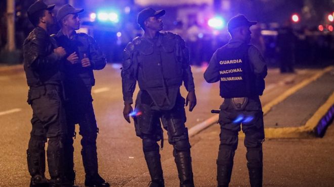 Venezuelan authorities inspect the area around the Supreme Court in Caracas, Venezuela, 27 June 2017