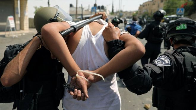 Israeli security forces arrest a Palestinian man following clashes outside Jerusalem's Old city, 21 July 2017