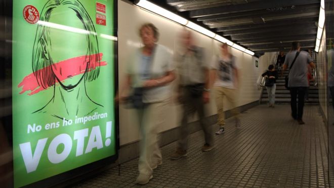 A poster in the Barcelona metro reads "They won't stop us voting!"