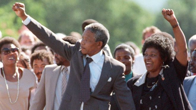 ANC leader Nelson Mandela and wife Winnie raise fists upon his release from Victor Verster prison in Paarl on 11 February 1990