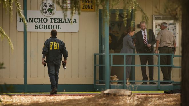FBI agents are seen outside the Rancho Tehama Elementary School after a shooting in Rancho Tehama, California.