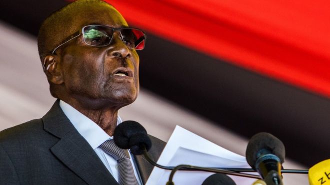 Zimbabwe's President Robert Mugabe speaks during the burial of Brigadier General James Murozvi, who was granted national hero status by President Robert Mugabe, at the National Heroes Acre in Harare, on April 12, 2017. / AFP PHOTO / Jekesai NJIKIZANA (Photo credit should read JEKESAI NJIKIZANA/AFP/Getty Images)