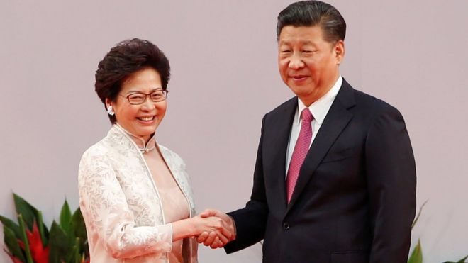 Hong Kong chief executive Carrie Lam shakes hands with Chinese President Xi Jinping after she swore an oath of office on the 20th anniversary of the city's handover from British to Chinese rule, in Hong Kong, China, 1 July 2017