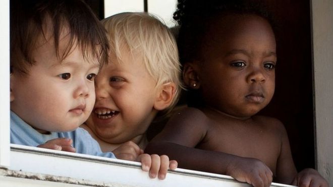 Children at a window in Maryland