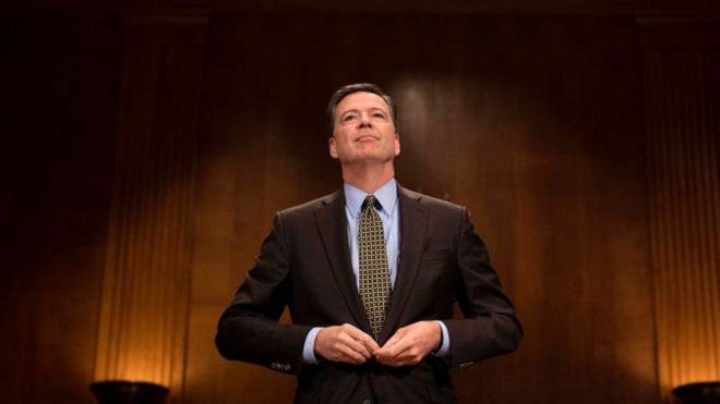 James Comey prepares to testify before a Senate committee.