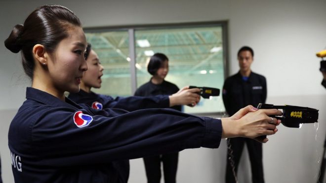 Korean Air crew practice using electric stun guns