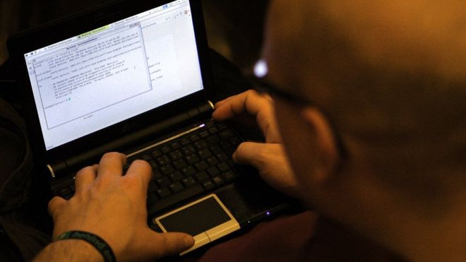 A participant looks at lines of code on a laptop on the first day of the 28th Chaos Communication Congress (28C3) - Behind Enemy Lines computer hacker conference on December 27, 2011 in Berlin, Germany.