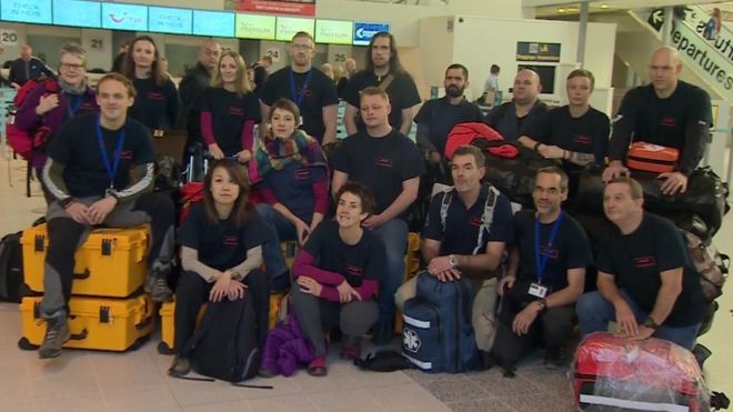 medics and their luggage in the airport