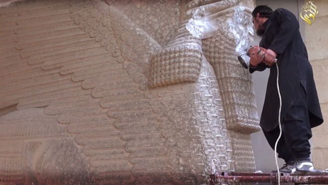 The so-called Islamic State defacing the Lamassu in Nineveh in 2015 (image: BBC)