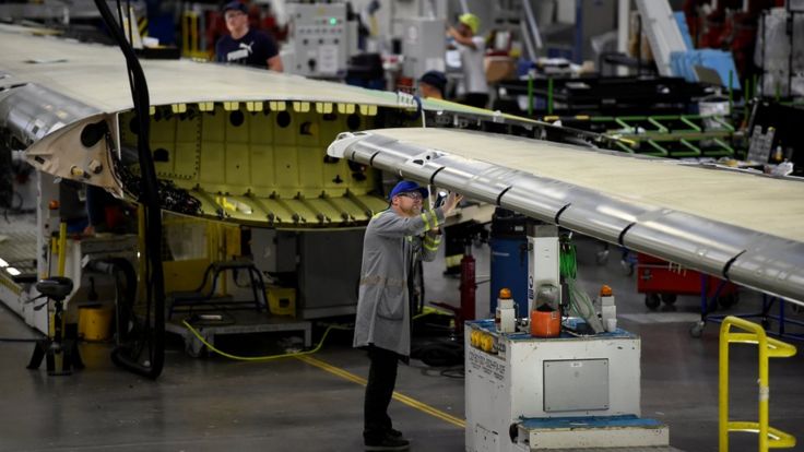 Workers at the Bombardier plant assemble wings for C-Series planes