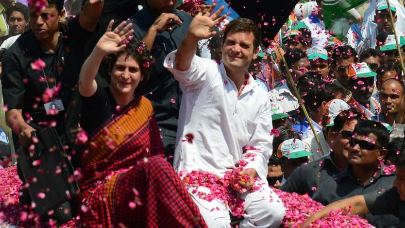 Rahul and sister Priyanka Gandhi are showered with flower petals as they ride on top of a car before Rahul filed his nomination for the 2014 elections in Amethi on April 12, 2014