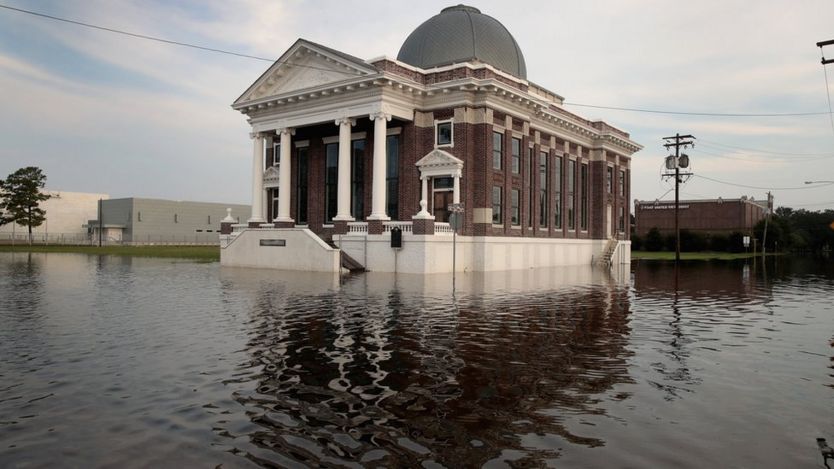 Floodwater surrounds a baptist church in Texas