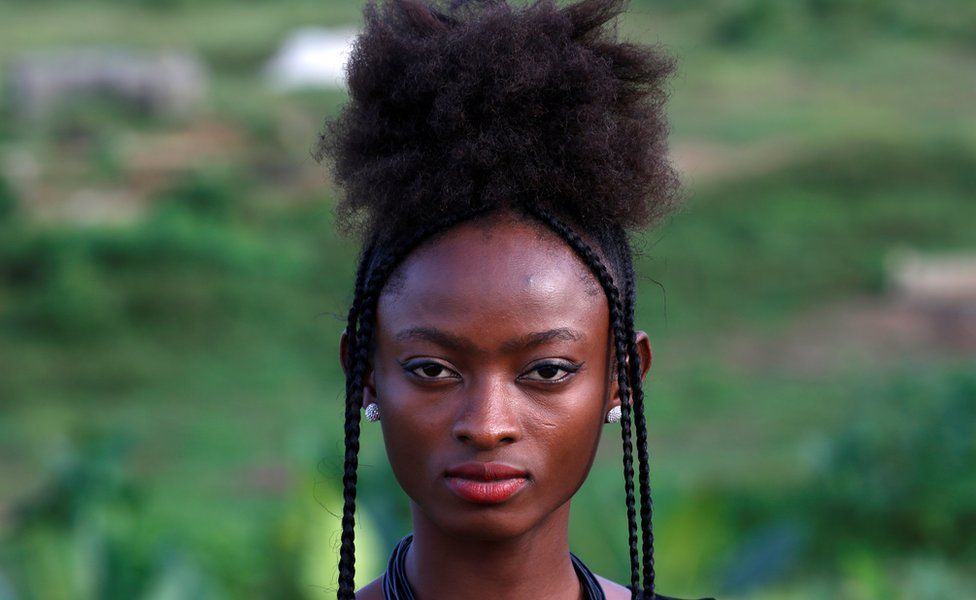 Sandra Kouadio poses with her hairstyle in Abidjan, Ivory Coast, October 13, 2017.