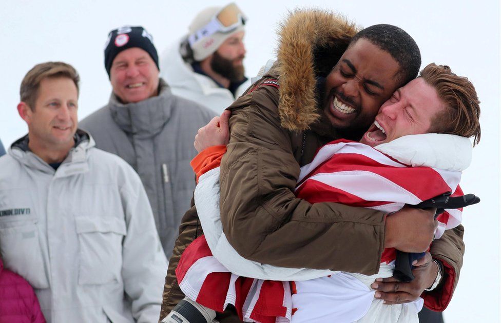 Shaun White hugs a friend in celebration