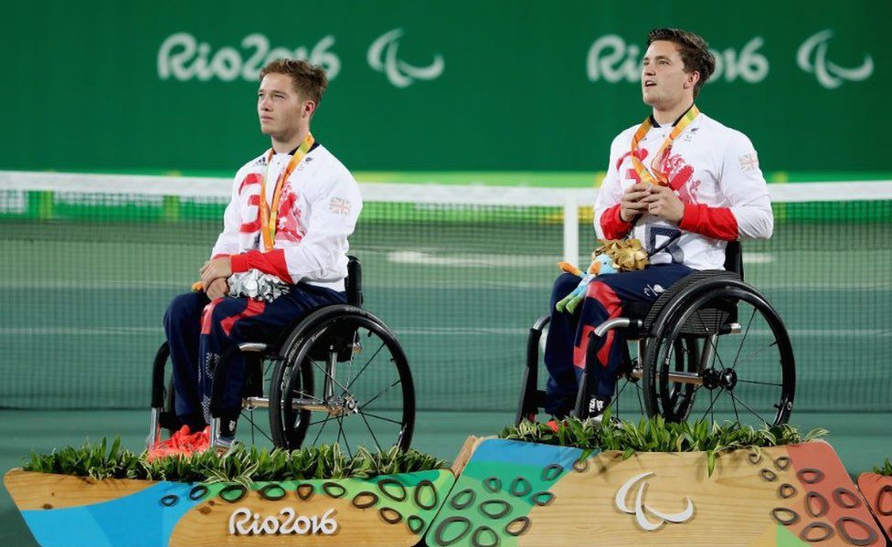 (L-r) Silver medallist Alfie Hewett and gold medallist Gordon Reid of Great Britain at the medal ceremony for the Men's Singles Wheelchair Tennis at the Rio 2016 Paralympic Games