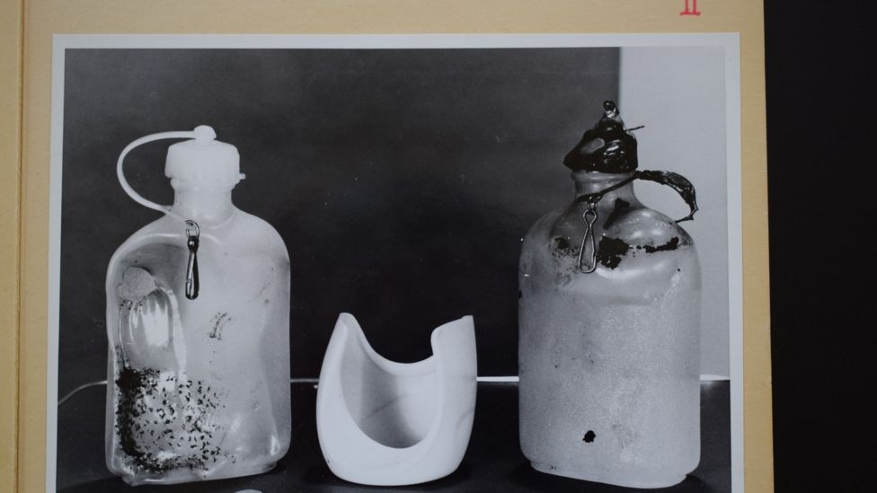 Police photo from Bergen State Archives showing two bottles found near the body of the woman