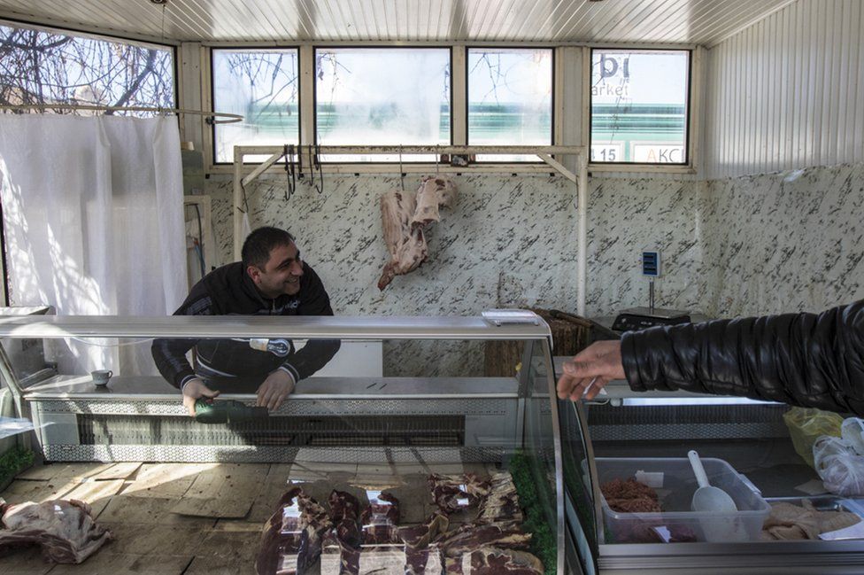 A man in his butcher's shop