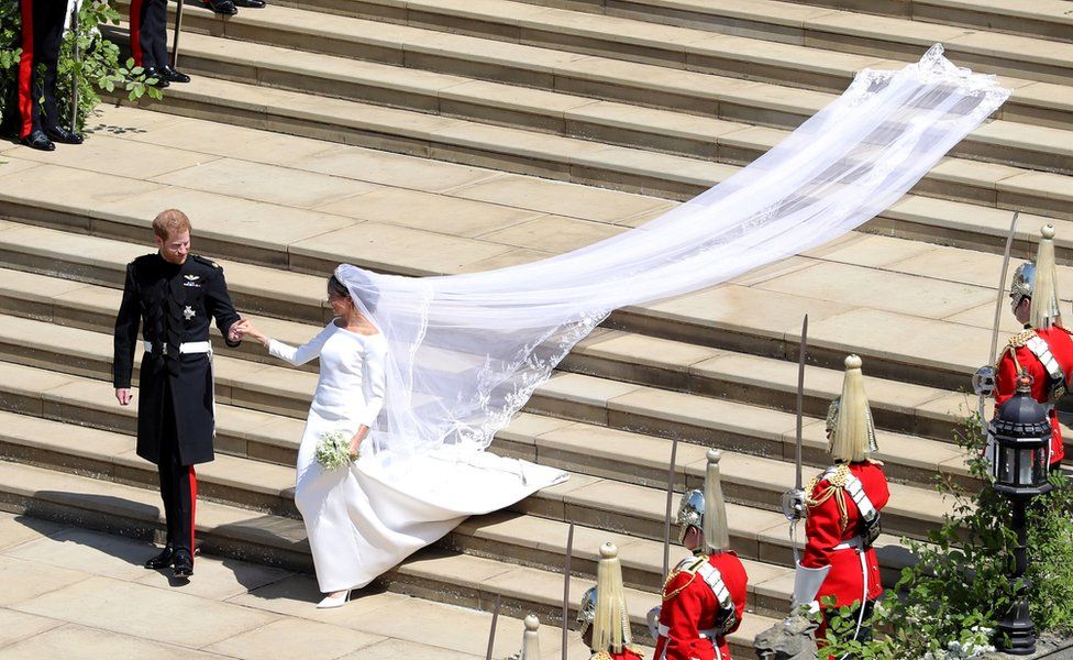 Prince Harry and Meghan Markle leave St George"s Chapel in Windsor Castle after their wedding