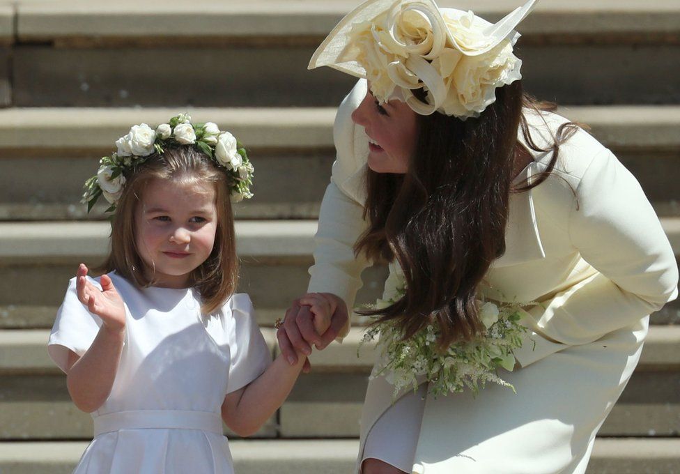Princess Charlotte waves next to her mother, the Duchess of Cambridge