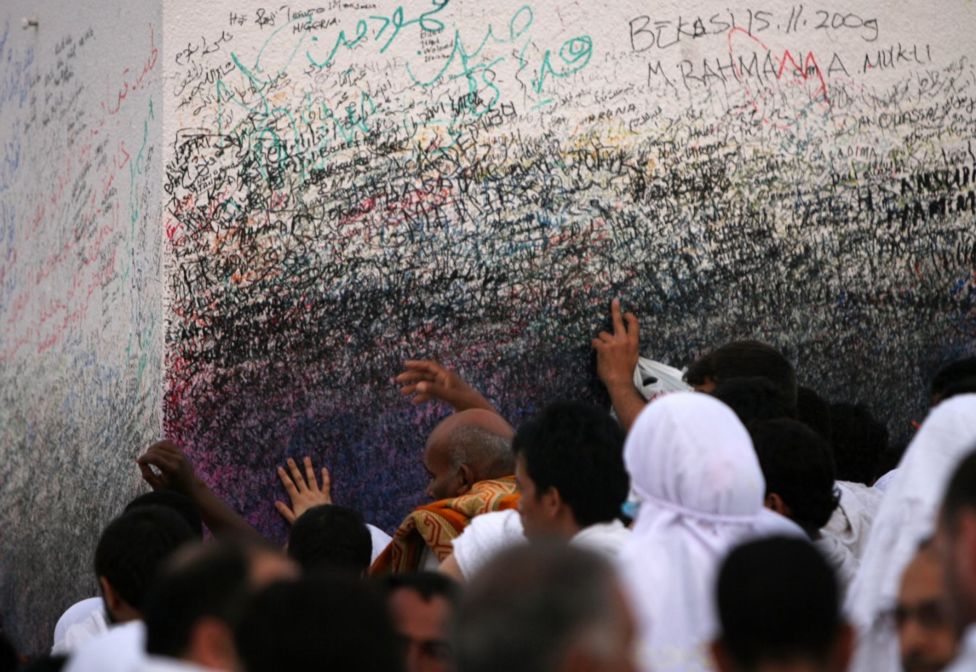 Muslim pilgrims gather at Mount Arafat, southeast of the Saudi city of Mecca on November 26, 2009. Some 2.5 million Muslims from more than 160 countries converge annually on the Islamic cities of Mecca and Medina in western Saudi Arabia for the hajj pilgrimage. AFP PHOTO/MAHMUD HAMS (Photo credit should read )