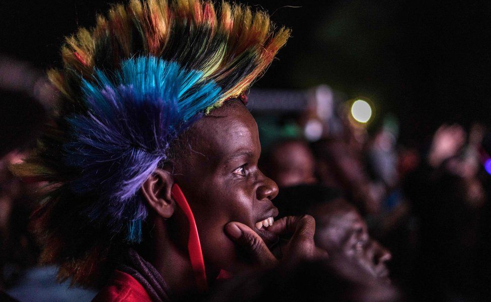 Someone in a Mohican watching New Year's Eve celebrations in Victoria Falls, Zimbabwe - Monday 1 January 2018