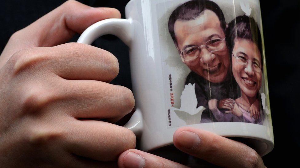 a mug with the couple's faces on