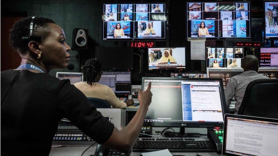 Staff work in a control during a news program at NTV studios in Nairobi on February 6, 2018. The Government disconnected three major Kenyan television channels, NTV, KTN News and Citizen TV, during their live coverage of Raila Odinga as he swore himself in on January 30, 2018, as "people"s president," despite losing in flawed elections last year. NTV and KTN News resumed broadcasts yesterday but Citizen TV remains to broadcast on internet only.