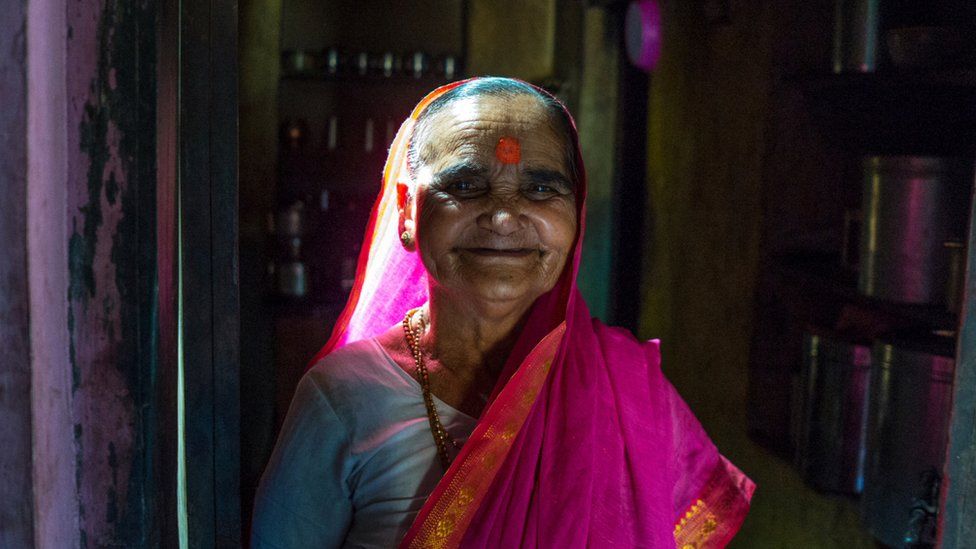 Ramabhai Ganpat smiling in a pink sari