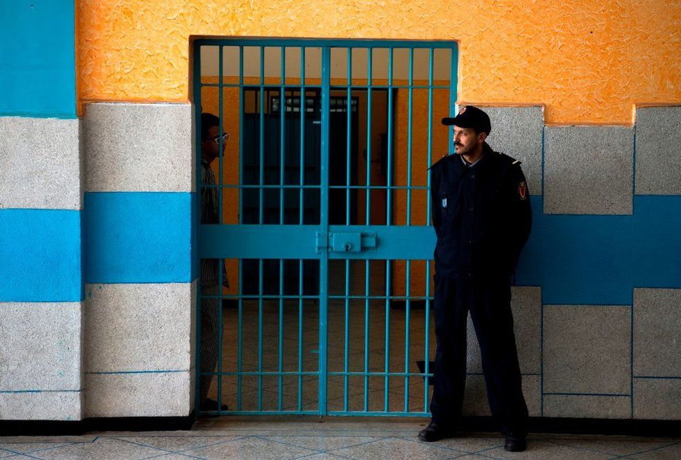 A prison warden stands guard at the Oukacha prison in Casablanca on February 2, 2018.