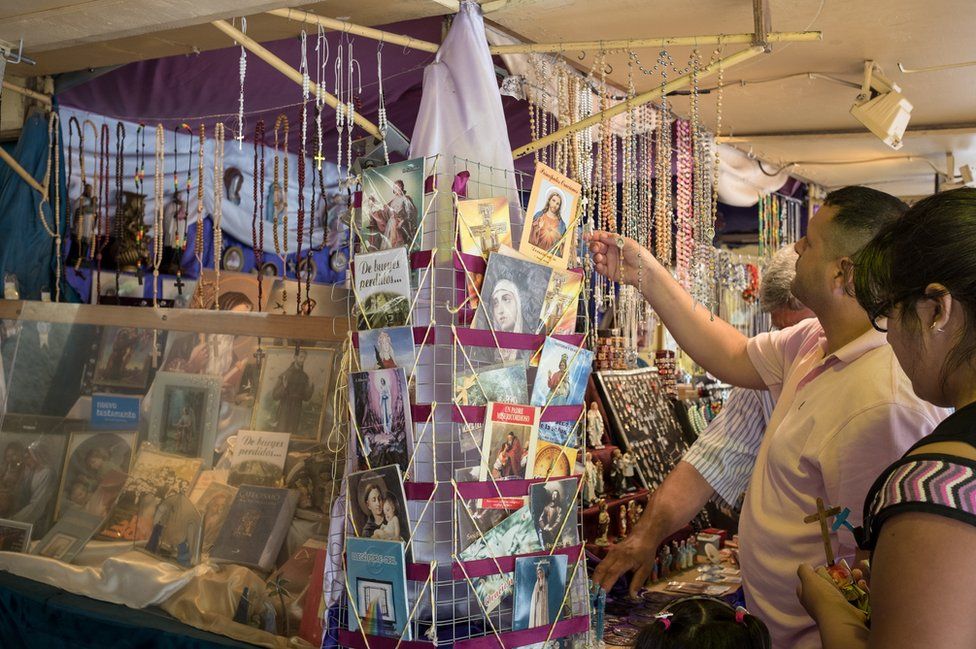 Tourists browse for cards