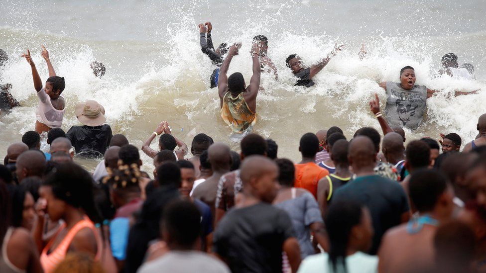 Crowds swimming on a beach in Durban, South Africa - Monday 1 January 2018