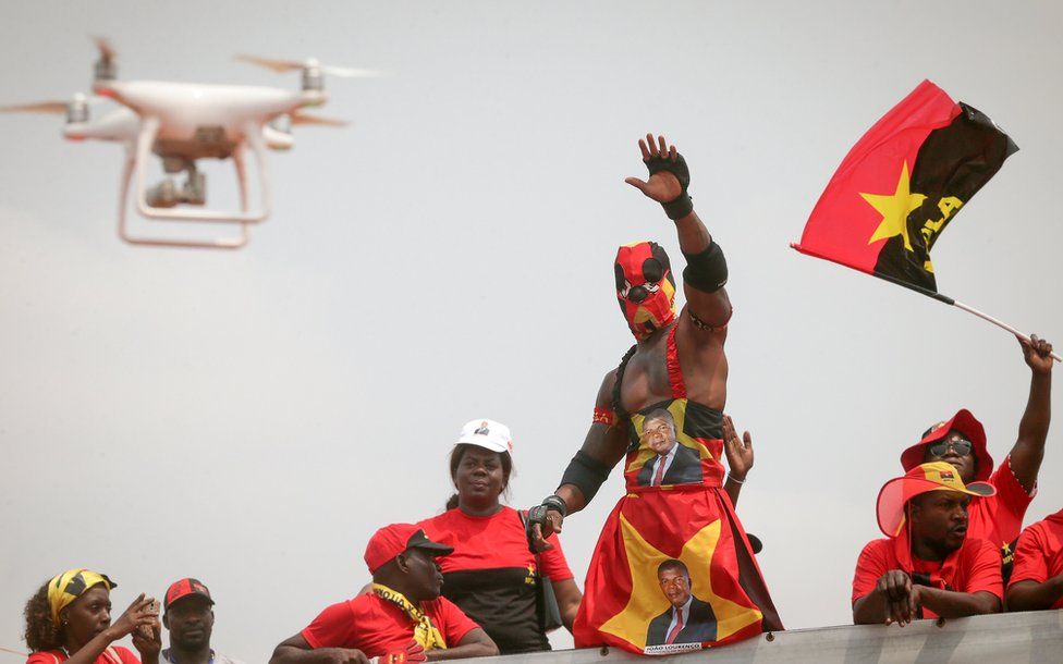 Supporters of Joao Lourenco (unseen), the candidate of the Popular Movement for the Liberation of Angola (MPLA), cheer during an elections campaign rally in Luanda, Angola, 19 August 2017.