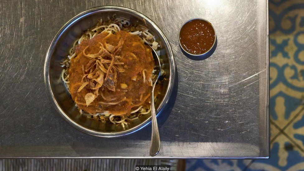 Koshari, a dish made with rice, lentils, pasta, tomato sauce, chickpeas, fried onions and dukkah at a restaurant in Heliopolis's food court