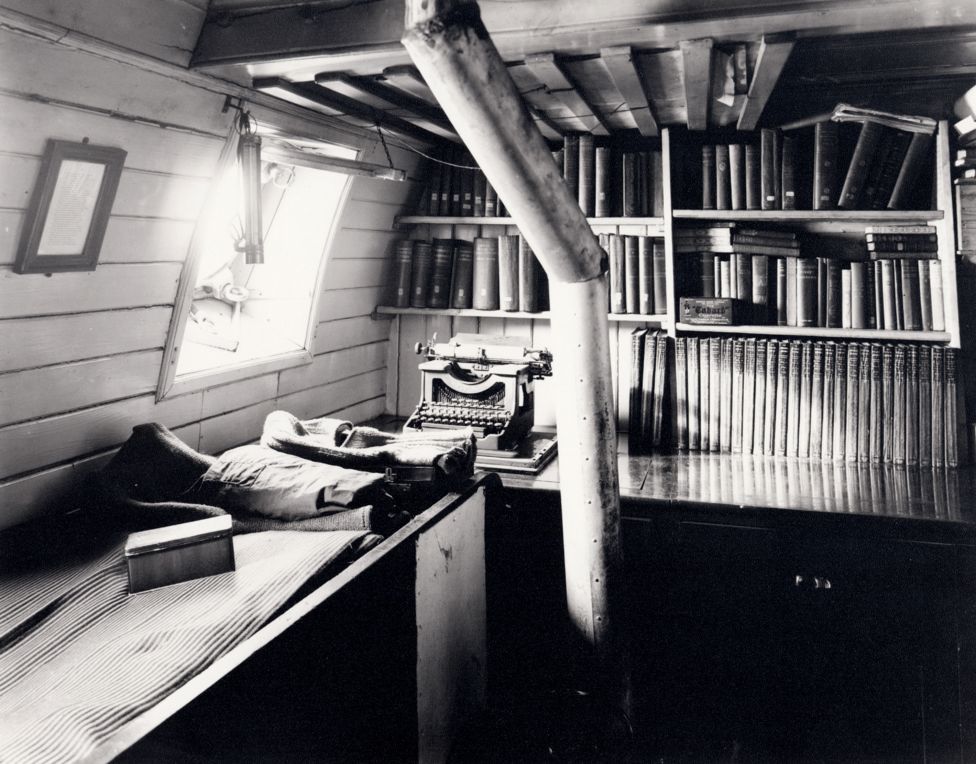 Black and white view of Shackleton's library on board the ship Endurance.