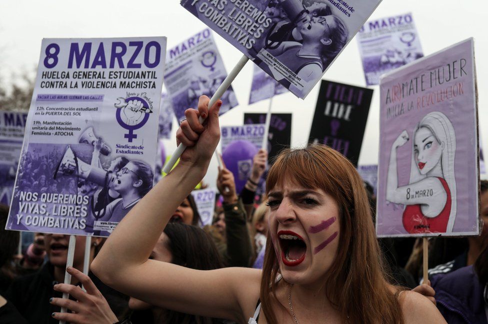Protesters take part in a demonstration during a nationwide feminist strike on International Women's Day in Madrid, Spain
