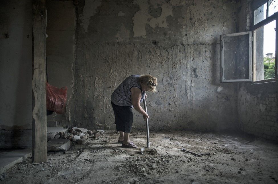 Maia Daiauri, aged 45, begins to prepare a former hospital room into a liveable environment
