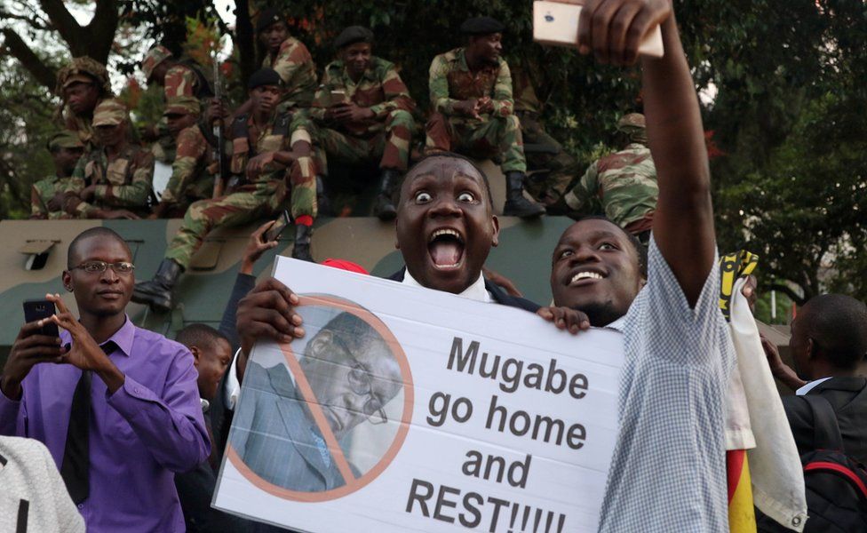 Zimbabweans celebrate after President Robert Mugabe resigns in Harare, Zimbabwe November 21 2017