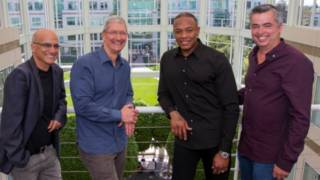 Jimmy Iovine, Apple CEO Tim Cook, Beats co-founder Dr. Dre, and Apple senior vice president Eddy Cue